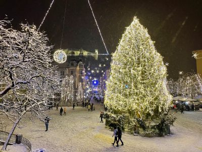 Vibrant Christmas lights illuminate Preseren Square on a cold wi